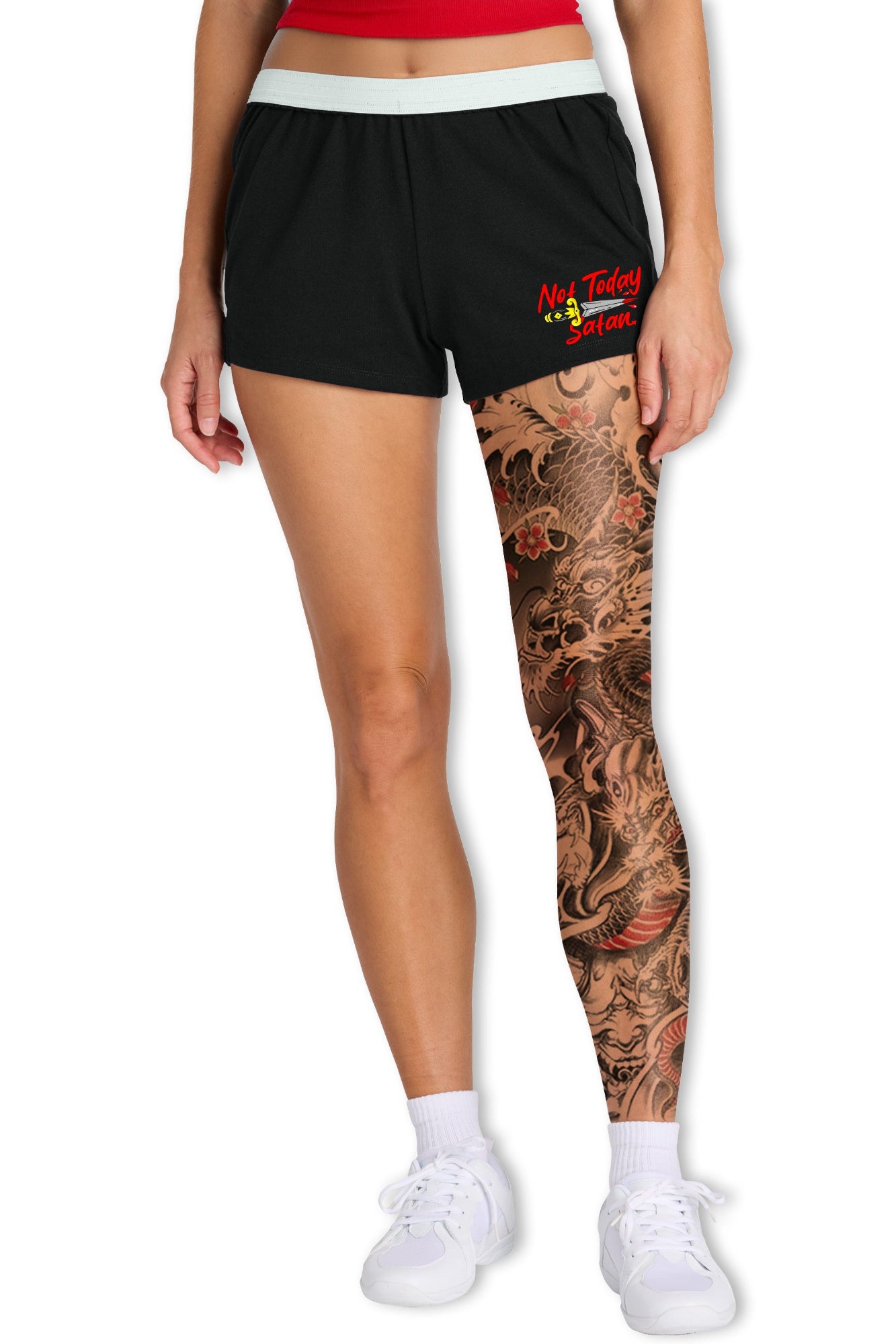 Person wearing black shorts with a logo on a white background